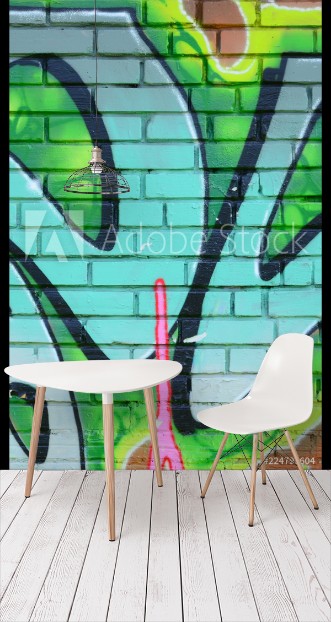 Picture of Fragment of graffiti drawings The old wall decorated with paint stains in the style of street art culture Colored background texture in green tones